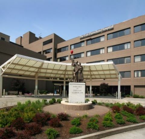 Fort Hamilton Hospital entrance with statue and garden